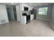 Open concept kitchen with stainless steel appliances at 735 Bertrend St, Englewood, FL 34223