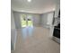 Bright living room with French doors leading to backyard at 735 Bertrend St, Englewood, FL 34223