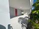 Red door access to side patio area at 735 Bertrend St, Englewood, FL 34223