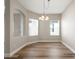 Bright dining room features hardwood floors, neutral walls, and a chandelier at 7512 Surrey Pines Dr, Apollo Beach, FL 33572