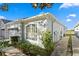 Side view of the house showing landscaping and walkway at 7512 Surrey Pines Dr, Apollo Beach, FL 33572