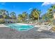 Community pool area with surrounding lounge chairs and patio area at 7512 Surrey Pines Dr, Apollo Beach, FL 33572