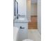 Bathroom featuring granite countertop vanity, and a doorway to the bedroom at 8317 N Ogontz Ave, Tampa, FL 33604