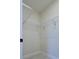Walk-in closet with metal shelving and bright white flooring at 8317 N Ogontz Ave, Tampa, FL 33604