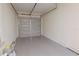 Spacious garage with newly painted floor and garage door providing ample room for parking and storage at 8317 N Ogontz Ave, Tampa, FL 33604