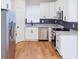Modern kitchen features white cabinets, stainless steel appliances, and granite countertops at 8317 N Ogontz Ave, Tampa, FL 33604