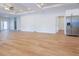 Spacious living room with hardwood floors, recessed lighting, a ceiling fan and stainless fridge at 8317 N Ogontz Ave, Tampa, FL 33604