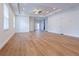 Spacious living room featuring hardwood floors, recessed lighting, ceiling fan, and white doors at 8317 N Ogontz Ave, Tampa, FL 33604