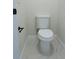 Small bathroom featuring toilet with white tile floors and black fixtures at 8317 N Ogontz Ave, Tampa, FL 33604