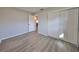 Bedroom with vinyl flooring and white sliding doors at 11185 104Th St, Largo, FL 33773