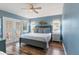 Spacious bedroom with a king-size bed, and access to a private balcony at 122 White Ave, Anna Maria, FL 34216