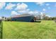 Home with grassy backyard and privacy fence at 13584 Old Creek Ct, Parrish, FL 34219