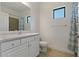 Bathroom with white vanity, shower, toilet at 13584 Old Creek Ct, Parrish, FL 34219