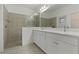 Modern bathroom with double vanity, large shower, and updated fixtures at 13584 Old Creek Ct, Parrish, FL 34219