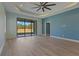 Bedroom with sliding glass doors and backyard view at 13584 Old Creek Ct, Parrish, FL 34219