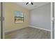 Bedroom with grey and yellow walls, wood flooring at 13584 Old Creek Ct, Parrish, FL 34219