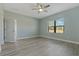 Bright bedroom with wood-look floors and ceiling fan at 13584 Old Creek Ct, Parrish, FL 34219