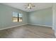 Light and airy bedroom with wood-look floors at 13584 Old Creek Ct, Parrish, FL 34219