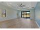 Bedroom with sliding glass doors leading to backyard at 13584 Old Creek Ct, Parrish, FL 34219