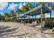 Poolside cabanas with lounge chairs for shade at 13584 Old Creek Ct, Parrish, FL 34219