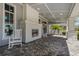 Relaxing covered porch with fireplace and rocking chairs at 13584 Old Creek Ct, Parrish, FL 34219