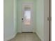 Front entry with white door and light green walls at 13584 Old Creek Ct, Parrish, FL 34219