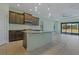 Modern kitchen with island and stainless steel appliances at 13584 Old Creek Ct, Parrish, FL 34219