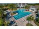 Community pool with lounge chairs and a large sundeck at 13584 Old Creek Ct, Parrish, FL 34219