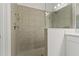 Walk-in shower with tile surround and glass enclosure at 13584 Old Creek Ct, Parrish, FL 34219