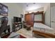 Guest bedroom with a Murphy bed and built-in wooden cabinetry at 1372 Emerald Dunes Dr, Sun City Center, FL 33573