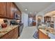 Spacious kitchen with granite countertops and stainless steel appliances at 1372 Emerald Dunes Dr, Sun City Center, FL 33573