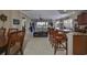 Open kitchen with granite island and breakfast bar at 1372 Emerald Dunes Dr, Sun City Center, FL 33573