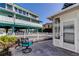 Small patio with seating and view of building and canal at 141 94Th Ave, Treasure Island, FL 33706