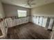 Under construction bedroom with new dark brown tile floors and a ceiling fan at 1863 New Hampshire Ne Ave, St Petersburg, FL 33703