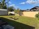 Spacious backyard with a storage shed, raised garden bed, and privacy fence at 2509 Hollis Dr, Tampa, FL 33618