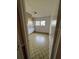 View of a bedroom with built-in shelving, patterned tile floor, seen from the doorway at 2509 Hollis Dr, Tampa, FL 33618