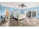 Serene main bedroom with light blue walls and access to the pool at 2711 Brattle Ln, Clearwater, FL 33761