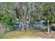 Ranch style home with mature trees and a fenced yard at 290 13Th N Ave, Safety Harbor, FL 34695