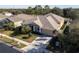 One-story home with a two-car garage and lush landscaping at 3602 Juneberry Dr, Wesley Chapel, FL 33543