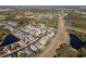 Aerial view of a residential neighborhood with houses, roads, and ponds at 3602 Juneberry Dr, Wesley Chapel, FL 33543
