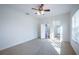 Spacious bedroom with ceiling fan and access to bathroom at 3602 Juneberry Dr, Wesley Chapel, FL 33543