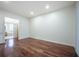 Hardwood floor bedroom with bathroom access at 3602 Juneberry Dr, Wesley Chapel, FL 33543