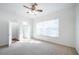 Bright bedroom with large window and ceiling fan at 3602 Juneberry Dr, Wesley Chapel, FL 33543