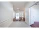 Bright entryway with hardwood floors and views into the living and dining room at 3602 Juneberry Dr, Wesley Chapel, FL 33543