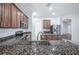 Granite kitchen with stainless steel appliances and breakfast bar at 3602 Juneberry Dr, Wesley Chapel, FL 33543