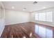 Living room with hardwood floors and large window at 3602 Juneberry Dr, Wesley Chapel, FL 33543