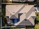 Top-down view of a house with a multi-level roof and screened enclosure at 3602 Juneberry Dr, Wesley Chapel, FL 33543