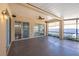 Covered patio with ceiling fan and sliding glass doors at 3602 Juneberry Dr, Wesley Chapel, FL 33543