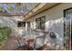 Outdoor patio area with table and chairs for relaxing and enjoying the Florida weather at 3703 Quail Hollow Pl, Bradenton, FL 34210