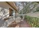 Outdoor patio featuring brick pavers, mature landscaping and seating area at 3703 Quail Hollow Pl, Bradenton, FL 34210